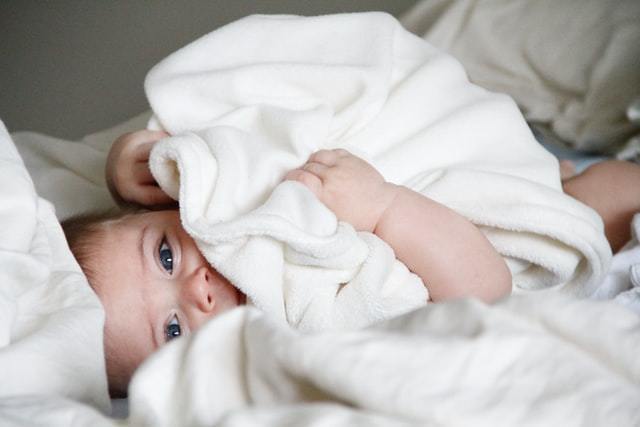 When Can Your Baby Sleep With a Blanket at Night?